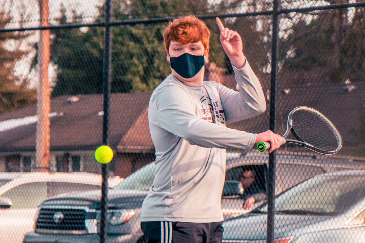 FILE PHOTO - Christian Iverson watches the ball as he prepares to swing during a doubles match against Black Hills earlier this season.